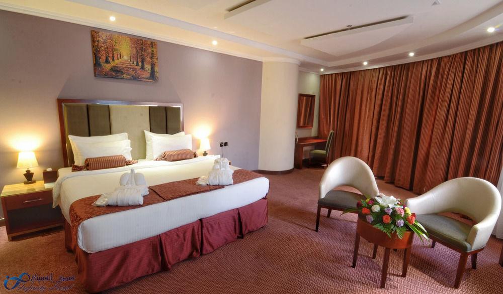 Al Massa Grand Hotel - Luxury room interior with Haram view, premium Umrah accommodation facilities and amenities