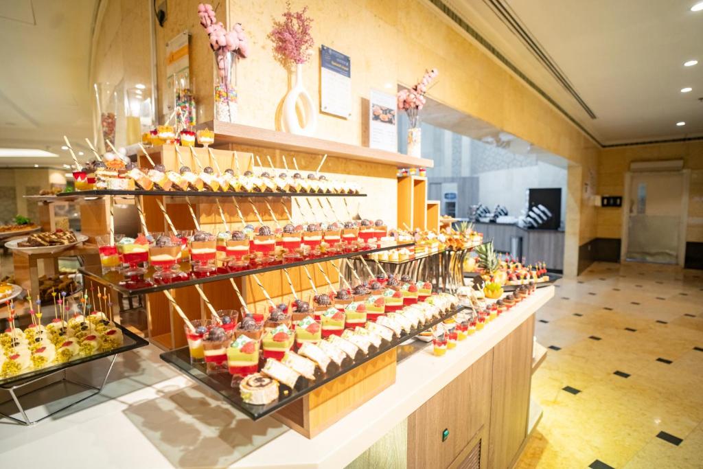 Emaar Grand Hotel Mecca - Luxury room interior with Haram view, premium Umrah accommodation facilities and amenities