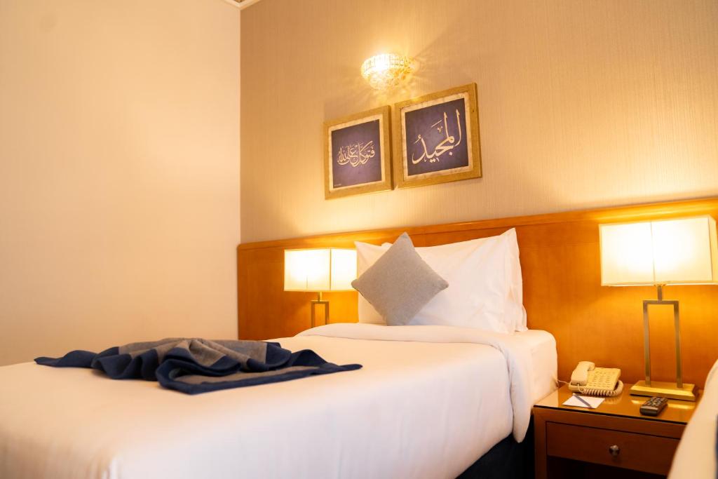 Emaar Grand Hotel Mecca - Luxury room interior with Haram view, premium Umrah accommodation facilities and amenities