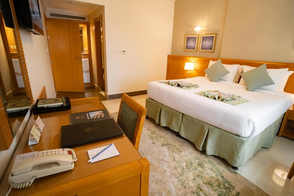 Emaar Grand Hotel Mecca - Luxury room interior with Haram view, premium Umrah accommodation facilities and amenities