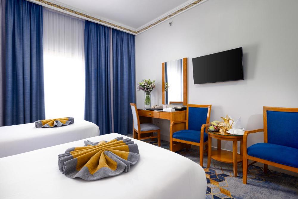 Emaar Grand Hotel Mecca - Luxury room interior with Haram view, premium Umrah accommodation facilities and amenities