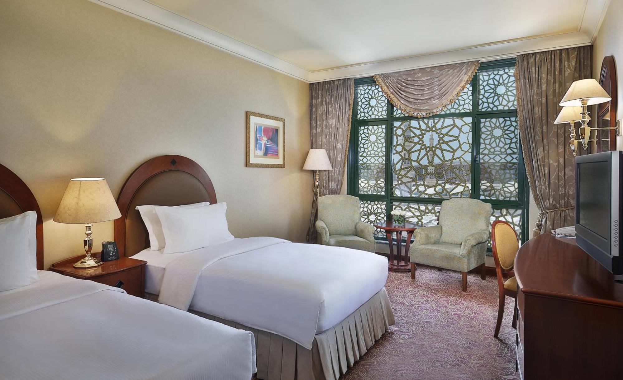 Madinah Hilton - Deluxe hotel room interior near Masjid Nabawi, Islamic heritage accommodation amenities